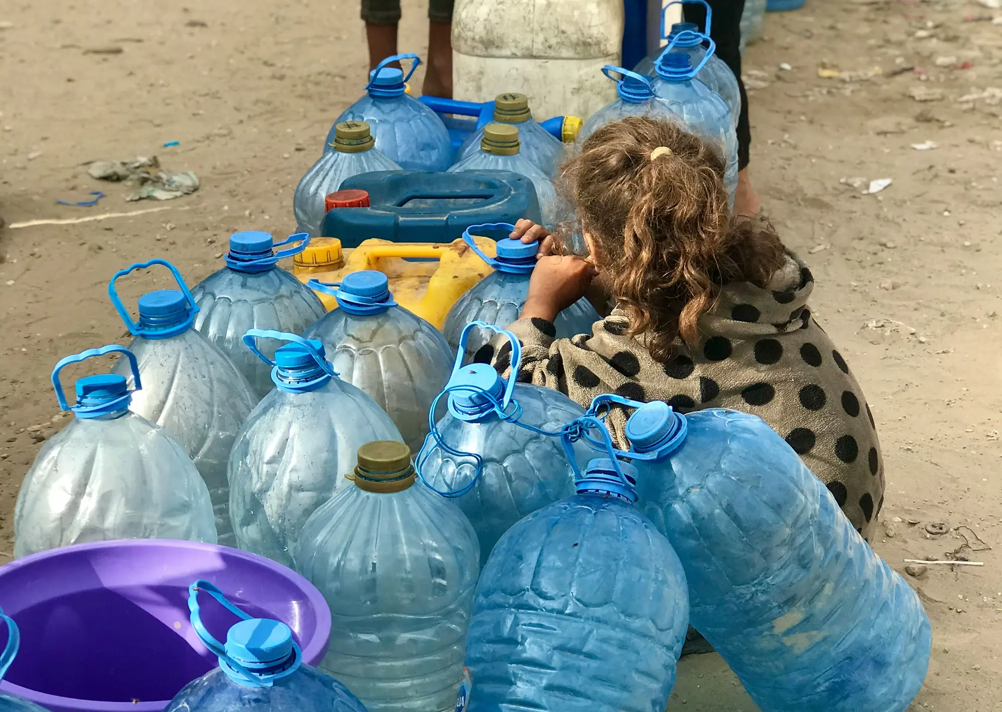 Girl with water in Gaza